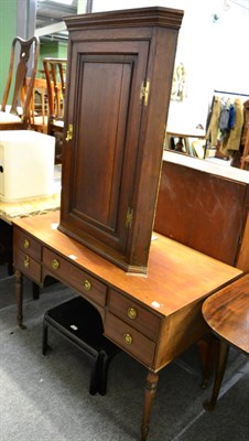 Lot 1119 - An early 19th century oak corner cupboard and a mahogany side table with central drawer and...