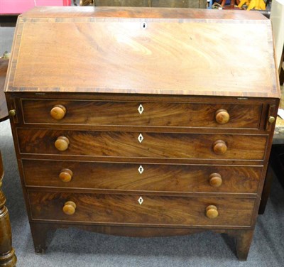 Lot 1124 - A mahogany bureau, early 19th century