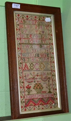 Lot 1187 - A 19th century needlework alphabet sampler worked by Janet Jenkiron dated 1830, in various colours