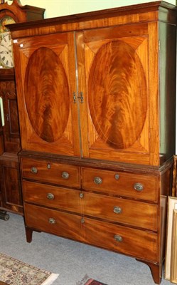 Lot 1210 - A George III inlaid mahogany linen press