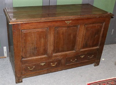 Lot 1214 - A George III oak three panel mule chest