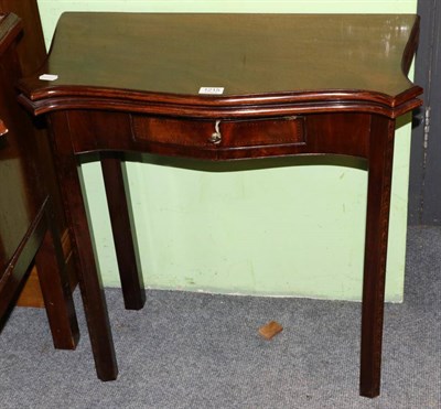 Lot 1215 - A 19th century inlaid mahogany fold over tea table