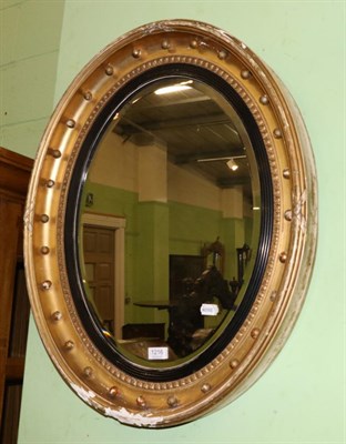 Lot 1216 - A Regency oval gilt wood mirror a/f