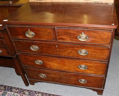 Lot 1247 - An early 19th century mahogany chest of drawers comprising three long drawers and two short drawers