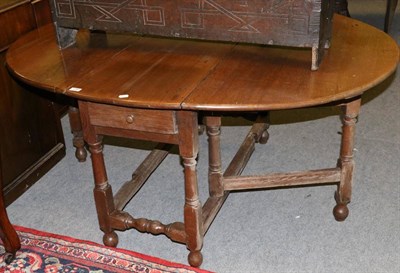 Lot 1250 - An oak 18th century style gateleg dining table