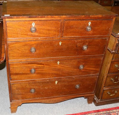 Lot 1253 - A George III cross banded mahogany four height chest of drawers