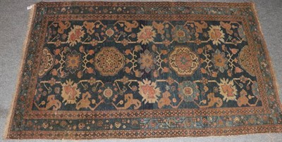 Lot 1283 - Hamadan rug, Iranian Kurdistan, the indigo field with columns of flowerheads enclosed by meandering