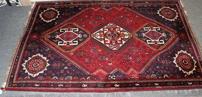 Lot 1285 - Kashgai rug, South West Iran, the crimson field with three stepped medallions framed by narrow...