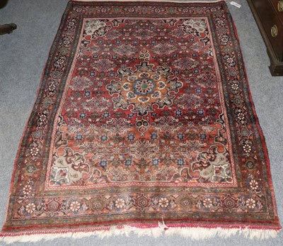 Lot 1295 - Bidjar rug, Iranian Kurdistan, the claret field with flowerhead medallion framed by spandrels...