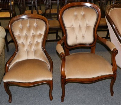 Lot 1311 - A button back open armchair, together with a matching ladies chair