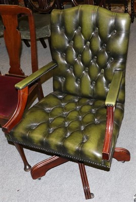 Lot 1312 - An early 20th century tub chair upholstered in gold fabric