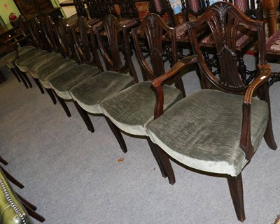 Lot 1321 - A set of eight Hepplewhite style mahogany shield back dining chairs including two carvers, with...