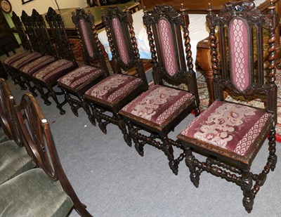 Lot 1322 - A set of six 17th century style carved oak dining chairs including two carvers together with a...