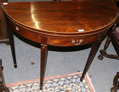 Lot 1324 - A George III demi-lune fold over tea table