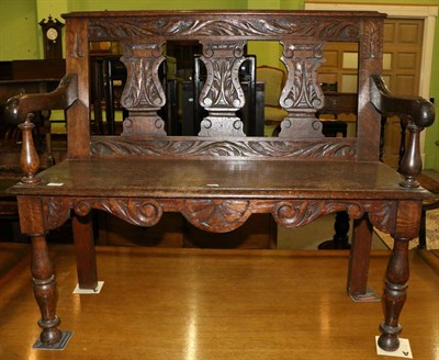 Lot 1328 - An oak hall bench