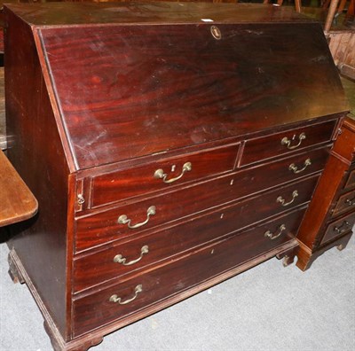 Lot 1334 - An early 19th century mahogany bureau