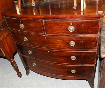 Lot 1342 - A George III mahogany bow front four height chest of drawers