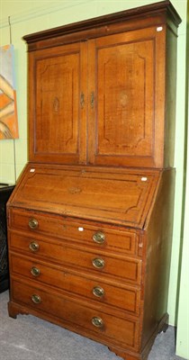 Lot 1368 - A 19th century oak bureau bookcase