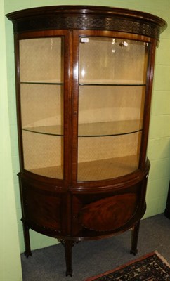 Lot 1370 - A mahogany bow fronted glazed display cabinet decorated with blind fret work