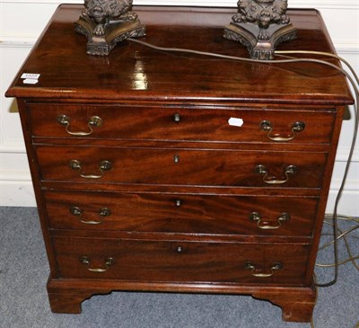 Lot 1373 - A 19th century four height chest of drawers of small proportions