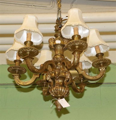 Lot 1374 - A brass six light chandelier