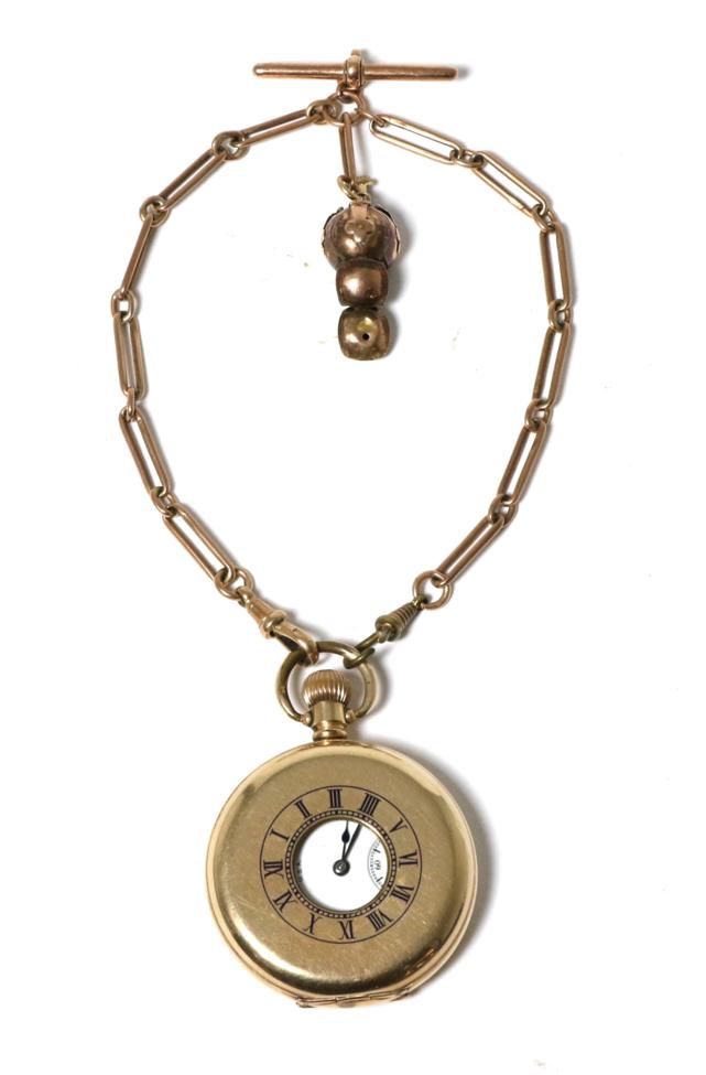 Lot 11 - A gold plated half hunter pocket watch, signed Waltham, with a 9 carat gold watch chain and...