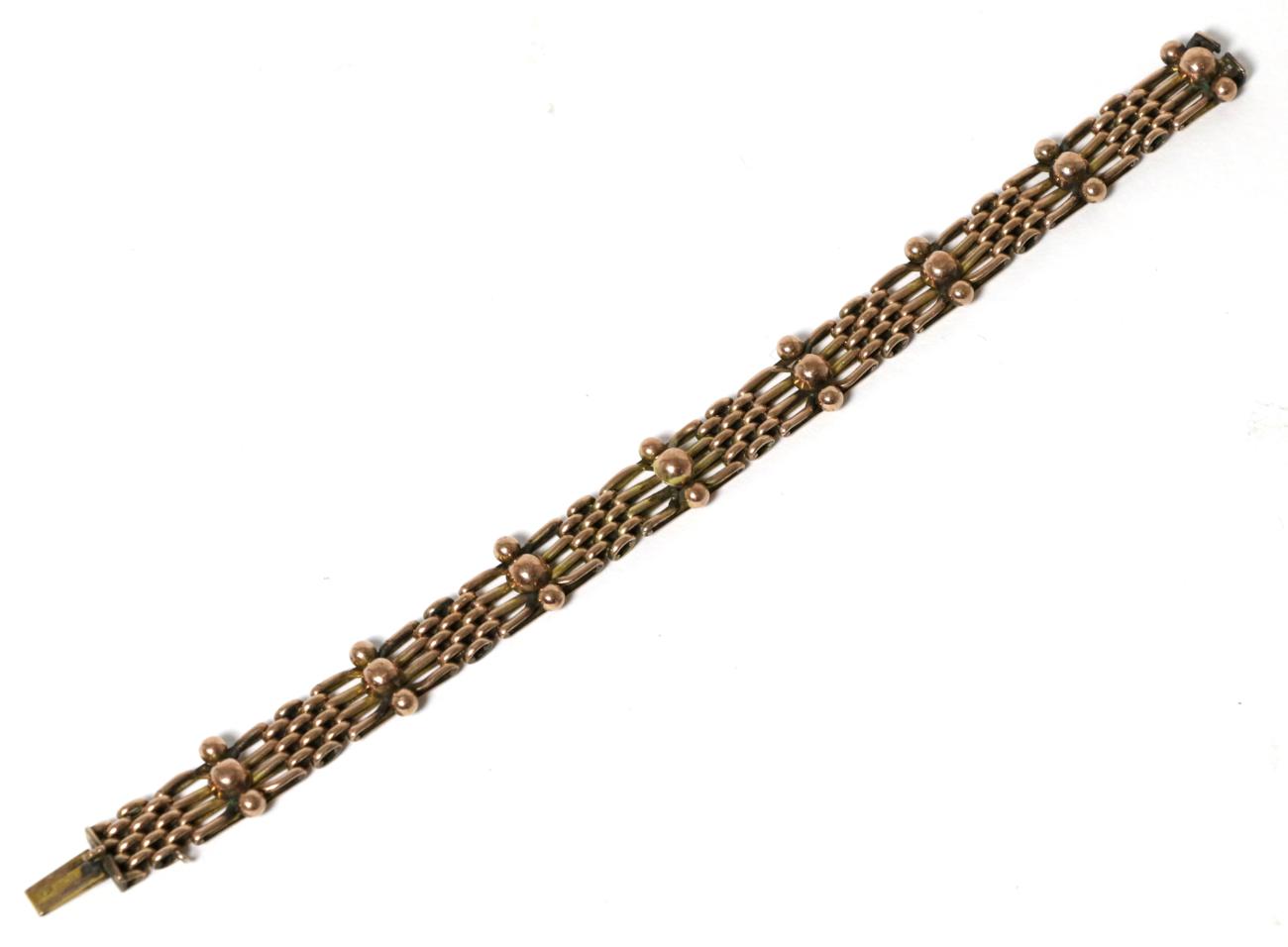 Lot 14 - A fancy gate link bracelet, with beaded detail, 18cm long, stamped '9'