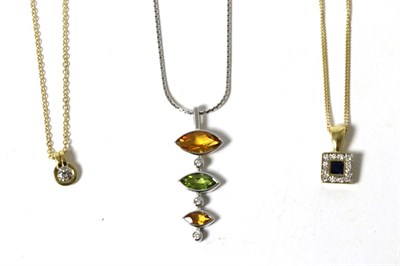 Lot 18 - An 18 carat gold solitaire diamond pendant, on chain, a round brilliant cut diamond in a board...