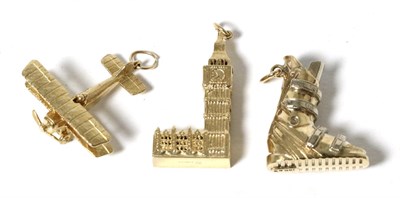Lot 27 - Three large 9 carat gold charms, viz; a ski boot, a biplane and Big Ben (3)