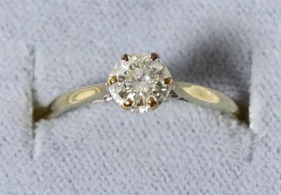 Lot 30 - A solitaire diamond ring, a round brilliant cut diamond in a claw setting, to an extended under...