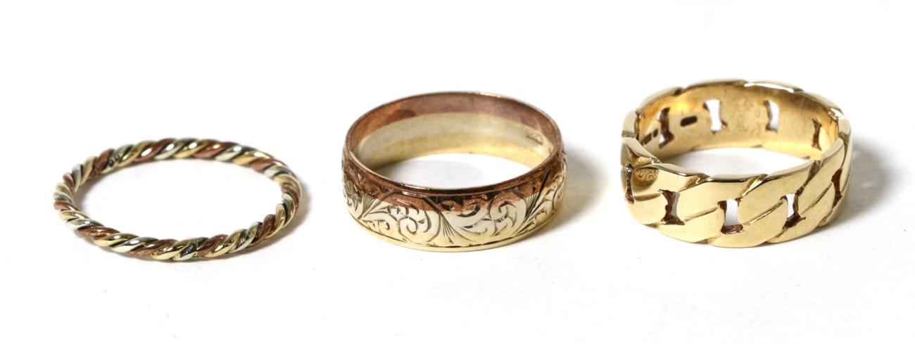 Lot 40 - A 9 carat gold cuban link motif band ring, finger size N, a 9 carat three colour gold foliate...