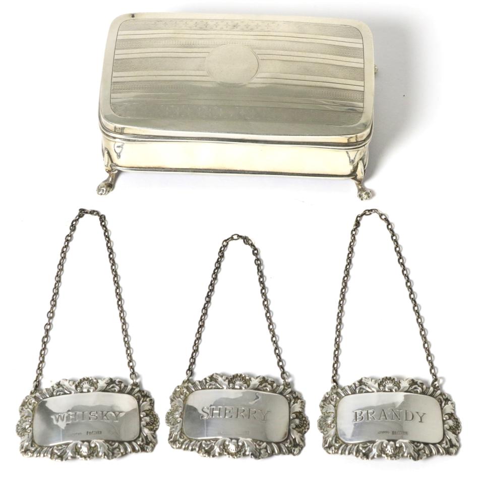 Lot 50 - Three silver decanter labels and a small silver jewellery box