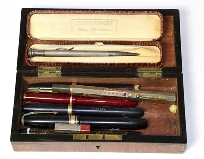 Lot 51 - A Waterman gold cased fountain pen with calendar facility and six other gold nib fountain pens...
