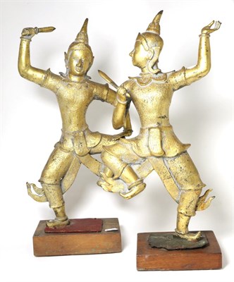 Lot 77 - Two gilt metal South East Asian figures of dancing warriors