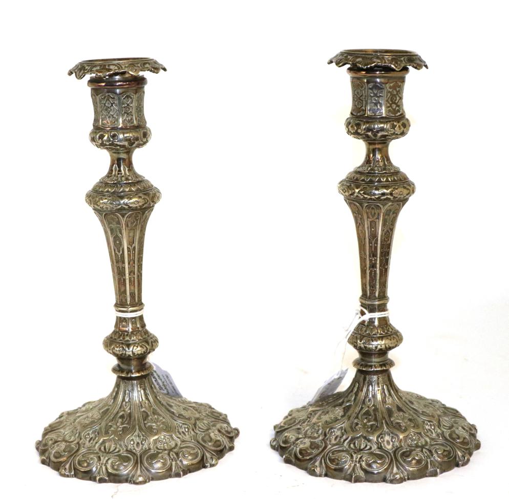 Lot 81 - A pair of Victorian Elkington electroplated cast candlesticks, date code for 1856,  in the...