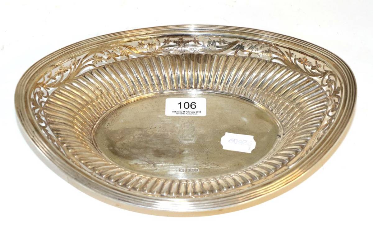 Lot 106 - A silver oval shaped pierced bowl, with a central family crest