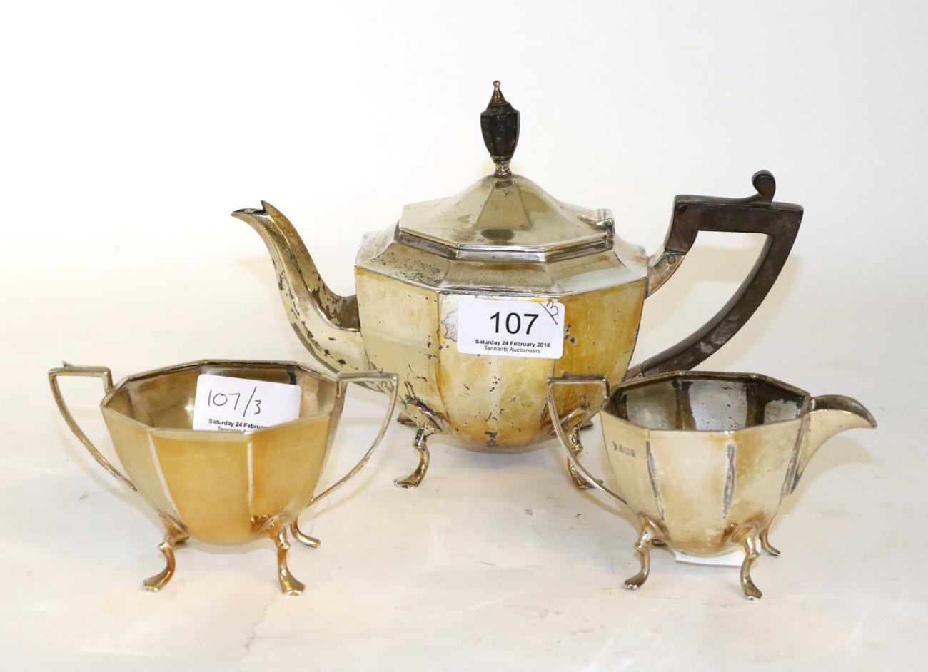 Lot 107 - An octagonal three piece silver bachelors tea service