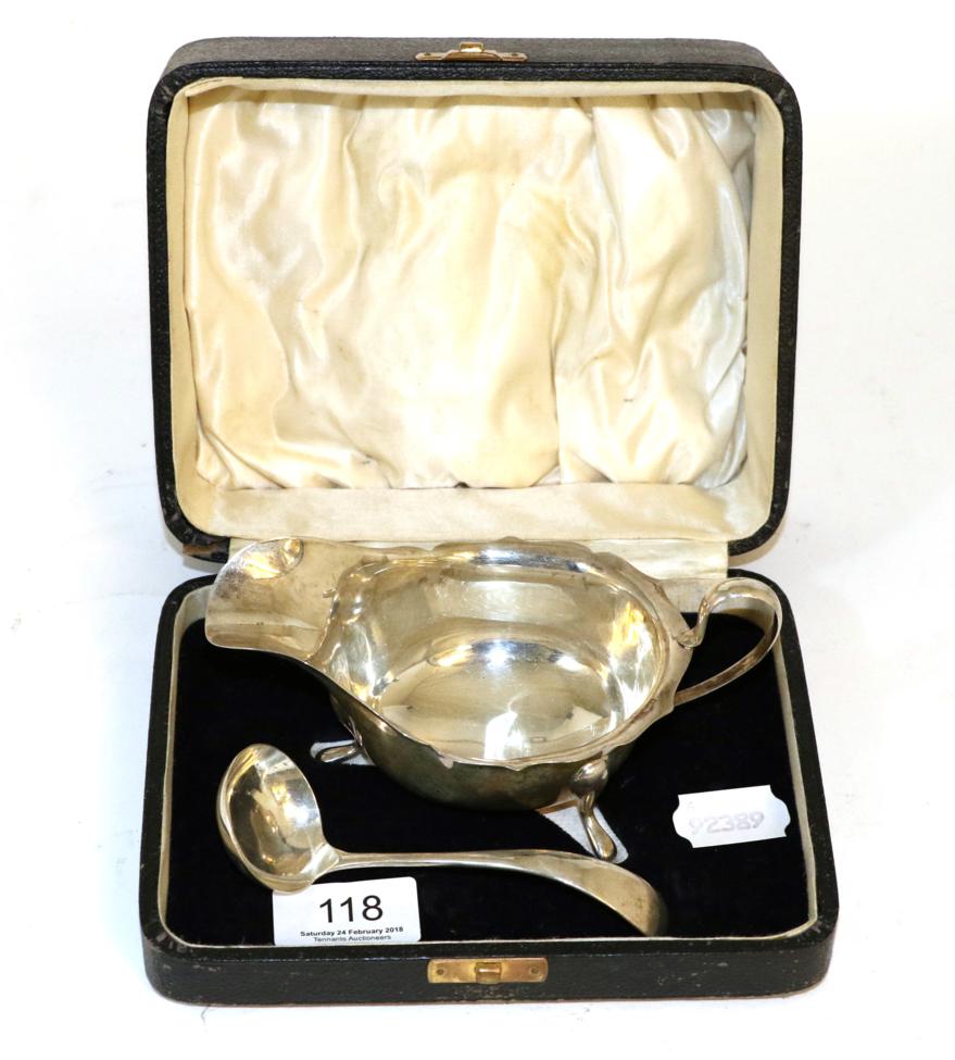 Lot 118 - A silver sauceboat and ladle, in fitted case