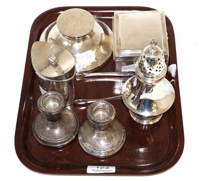 Lot 123 - A group of silver items, comprising: a cigarette box; a caster; a capstan inkwell; a pair of...