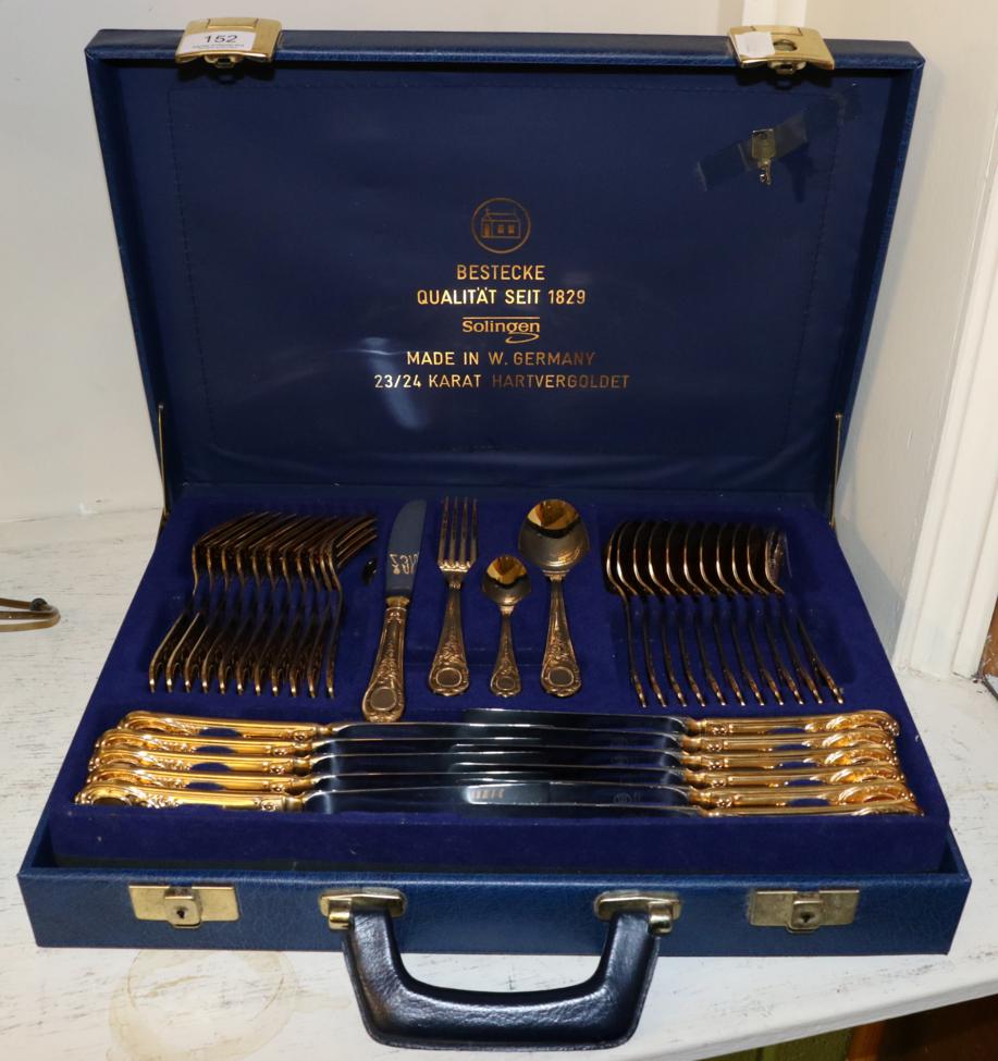 Lot 152 - A West German gold plated table service in a blue briefcase canteen