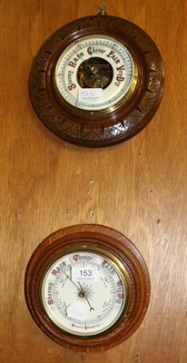 Lot 153 - Two oak cased aneroid barometers