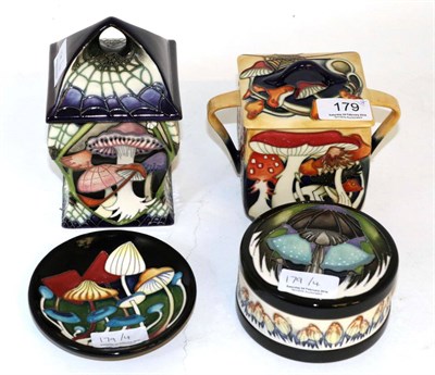 Lot 179 - Four pieces of Moorcroft pottery comprising: Pixie Parasols coaster by Emma Bossons, Twilight...