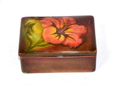 Lot 205 - A Moorcroft Hibiscus flambe rectangular box and cover