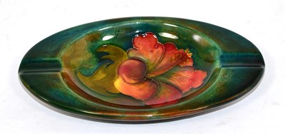 Lot 206 - A Moorcroft Hibiscus flambe oval ash tray by Walter Moorcroft