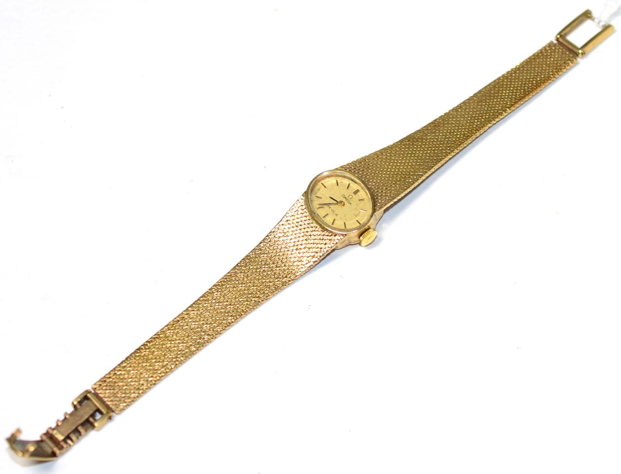 Lot 232 - A lady's 9ct gold wristwatch, signed Omega, De Ville, lever movement, Omega 9ct gold integral...