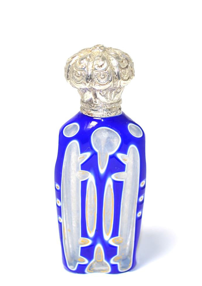 Lot 236 - A Victorian overlaid and gilded glass scent bottle with white metal mount