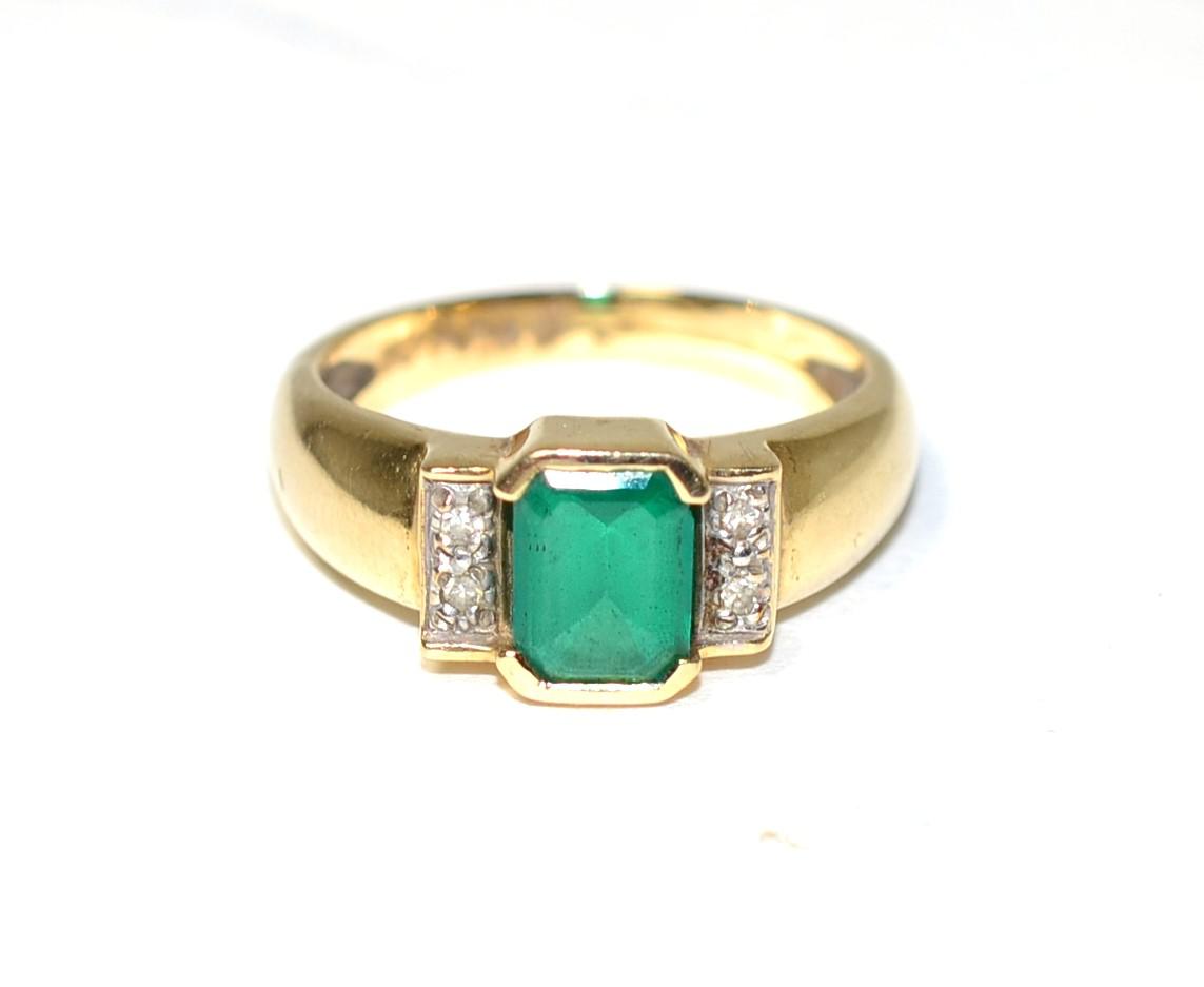 Lot 248 - A 9 carat gold synthetic emerald and a diamond ring, an octagonal cut emerald in a rubbed over...