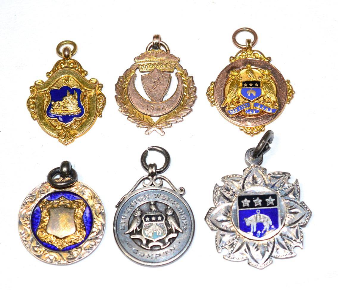 Lot 249 - Two 9 carat gold Leeds & District Football Association medallions, another for the Rothwell Charity