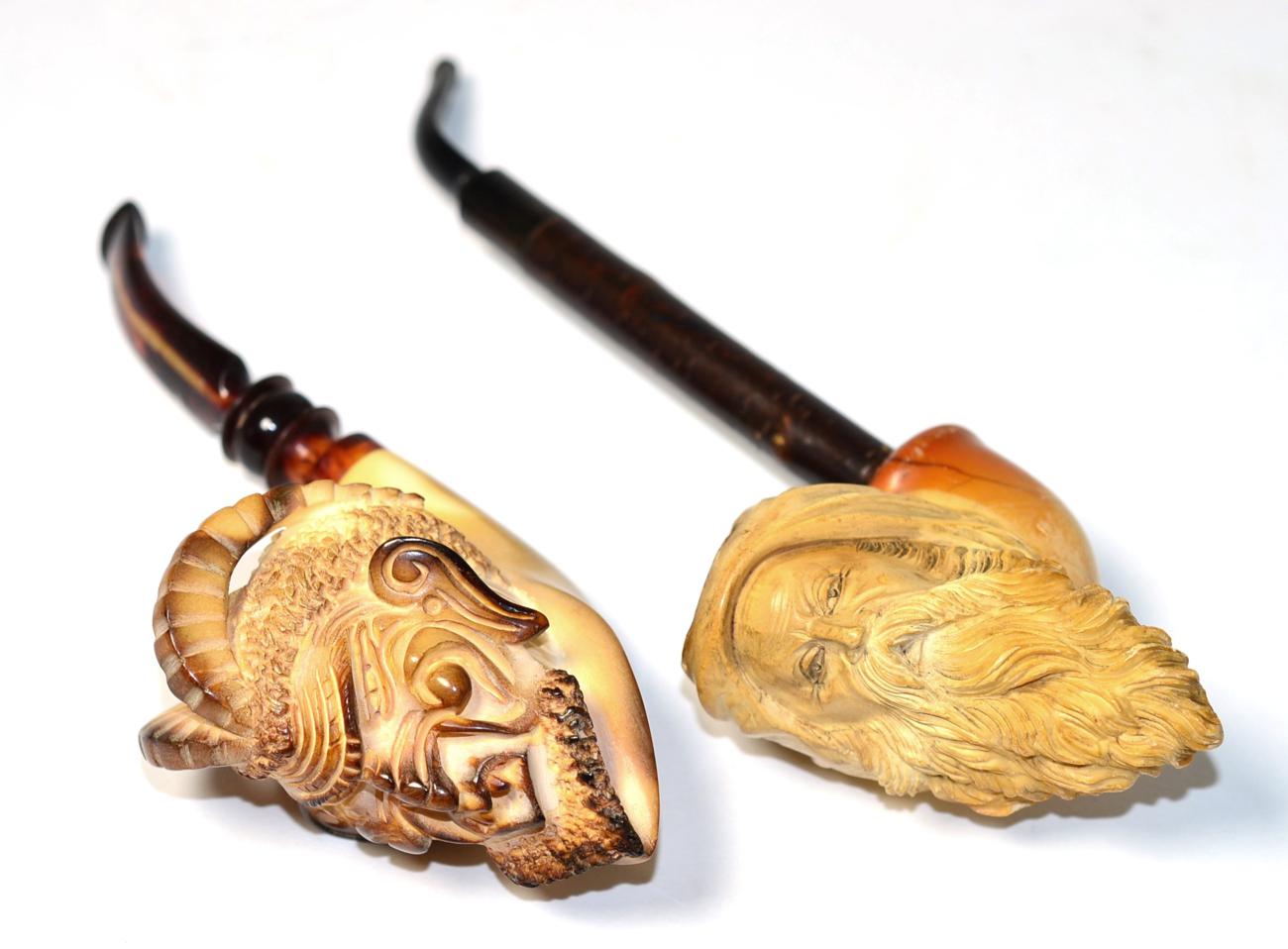 Lot 255 - Two meerschaum pipes; bearded man and mask