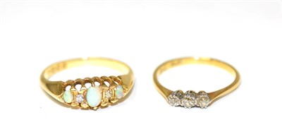 Lot 256 - An 18 carat gold opal and diamond ring, three oval cabochon opals, spaced by old cut diamonds,...